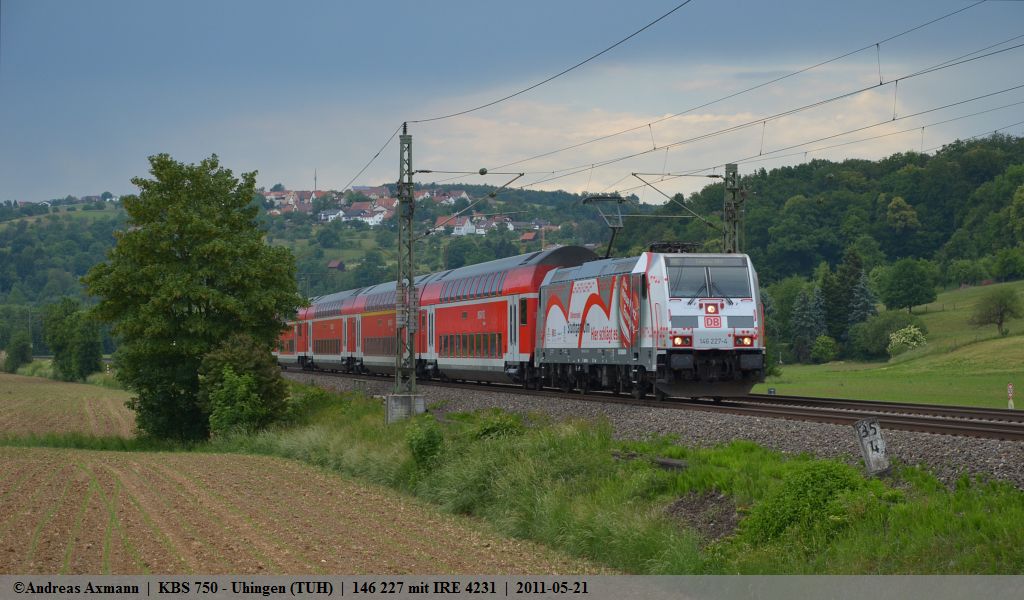 Whrend in Stuttgart Starkregen und Hagel den Verkehr behindern, fhrt 146 227 mit ihrem IRE 4231 ohne einen Tropfen Regen durch das Filstal in Richtung Ulm/Lindau durch Uhingen. (21,05,2011)