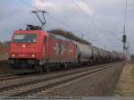 185 585 fhrt mit einem Kesselzug in Richtung Stuttgart bei Ebersbach/Fils an mir vorbei. (28,02,2011)