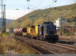rt-und-l-rail-technology-und-logistics-gmbh 203 148-2 der rt & l bei der durchfahrt durch Esslingen/Neckar mit Kran und Schotterwagen. (29,10,2010)