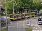 Stadtbahn Stuttgart DUEWAG DT8.4 mit Werbung 'Bauernmarkthalle' f�hrt nach seiner Abfahrt als U14 aus der Haltestelle Wilhelma auf die Neckartalstra�e in Richtung Remseck. (25,04,2010)
